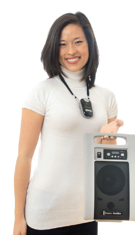 Individual holding a simeon audita II fm portable classroom audio speaker soundfield system. Person is wearing a wireless pendant transmitter microphone with a lanyard.