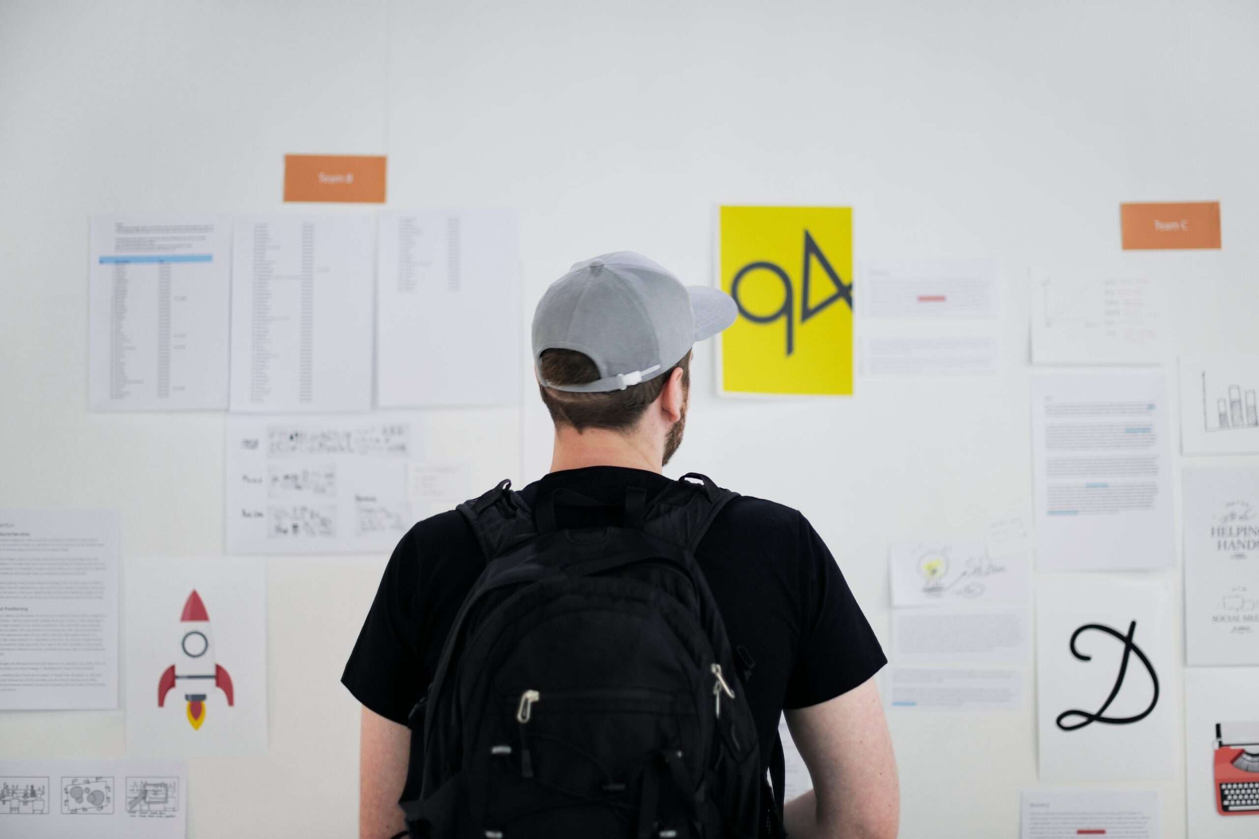 a student studies a wall. this student may have low vision. the student is in focus whereas the images are not